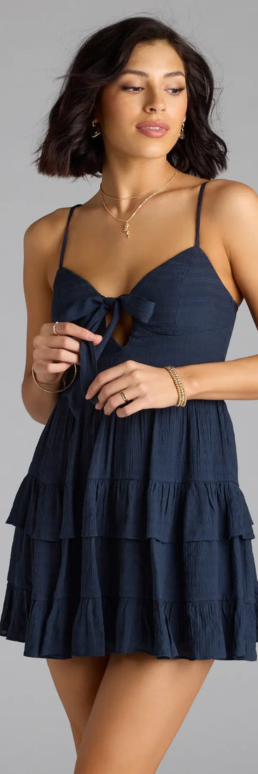 The So Effortless Tie-Front Ruffled Skater Dress is your new go-to navy blue dress—effortless, versatile, and made to update your fall style in seconds.