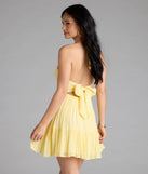 Shine with confidence, elegance, and standout style in the Ace The Test Open Tie Back Skater Dress—a yellow graduation dress designed with a fresh silhouette and the latest trends.