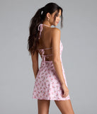 Whether you're headed to brunch or running errands, the Falling For Charm Strappy Open Back Floral Mini Dress in pink delivers effortless style in a breathable, go-to casual dress.