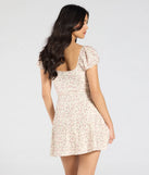 The So Lovely Floral Eyelet Mini Dress in natural brings sleek style to any graduation outfit, from cap and gown to after-party.