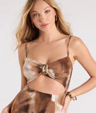 The Somewhere Tropical V-Neck Cutout Abstract Maxi Dress is a flowy, brown maxi dress that moves with you from sunny days to elevated nights in effortless style.