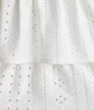 The Sunset Happy Hour Ruffled Skater Dress in white brings sleek style to any graduation outfit, from cap and gown to after-party.