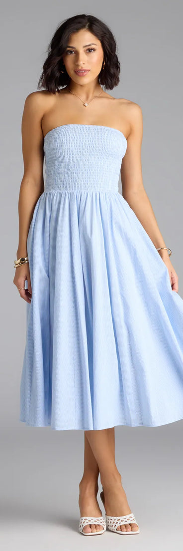 Step into summer looking effortlessly chic in the Breeze By Strapless Striped A-Line Midi Dress in light blue, a must-have Windsor dress for your warm-weather wardrobe.