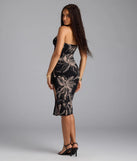 Step into summer looking effortlessly chic in the Island Breeze Tropical Slit Midi Dress in black, a must-have Windsor dress for your warm-weather wardrobe.
