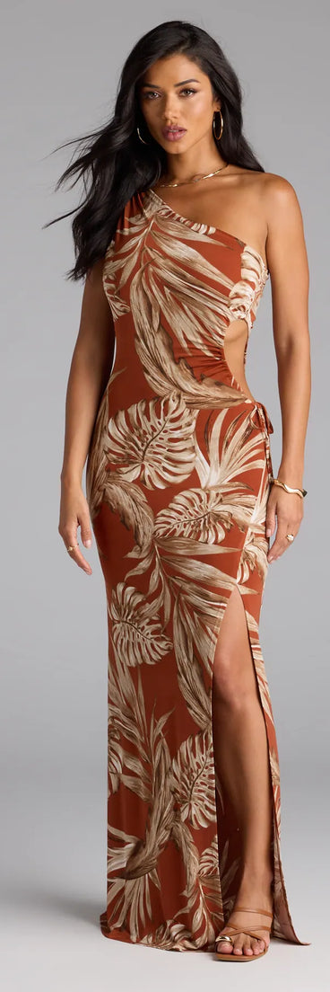 Step into the new season looking effortlessly chic in the Island Style One-Shoulder Slit Tropical Maxi Dress in rust, a must-have Windsor dress for your cool-weather wardrobe.