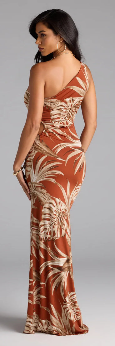 Soak up the season in the Island Style One-Shoulder Slit Tropical Maxi Dress, a rust sundress styled for easy days, outdoor plans, and everything in between.