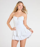Feel confident and photo-ready in the Sweetest Outing Tie Back Ruffled Skater Mini Dress, a white graduation dress perfect for 2025 ceremonies and parties.