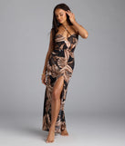 Soak up the season in the Island Hottie Tropical Halter Slit Maxi Dress, a black sundress styled for easy days, outdoor plans, and everything in between.