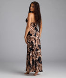 Soak up the season in the Island Hottie Tropical Halter Slit Maxi Dress, a black sundress styled for easy days, outdoor plans, and everything in between.