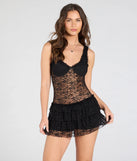 The Dainty And Divine Sheer Lace Bodycon Ruffle Mini Dress in black brings edge and energy to your vibe, ready to elevate any festival look or concert outfit.