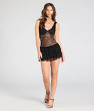 Make a bold statement in the Dainty And Divine Sheer Lace Bodycon Ruffle Mini Dress in black, the perfect summer dress for weddings, cocktail hours, nights out, and/or seasonal celebrations.