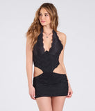 The In Love And Lace Halter Cutout Lace Mini Dress in black brings edge and energy to your vibe, ready to elevate any festival look or concert outfit.
