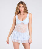 The Dainty And Divine Sheer Lace Bodycon Ruffle Mini Dress in light blue brings edge and energy to your vibe, ready to elevate any festival look or concert outfit.