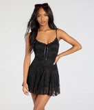 The Falling In Love V-Neck Lace A-Line Mini Dress in black brings edge and energy to your vibe, ready to elevate any festival look or concert outfit.