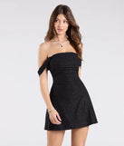 Feel confident and photo-ready in the Classic Glitz Glitter Knit Off-The-Shoulder Mini Dress, a black graduation dress perfect for 2025 ceremonies and parties.