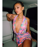 The Bring The Heat Halter Open Back Abstract Mini Dress in pink brings edge and energy to your vibe, ready to elevate any festival look or concert outfit.