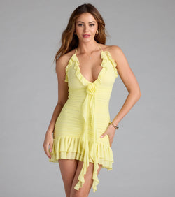 Step into summer looking effortlessly chic in the Talkin' Flirty Halter Floral Bodycon Mini Dress in yellow, a must-have Windsor dress for your warm-weather wardrobe.