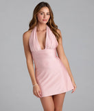 Step into summer looking effortlessly chic in the Ever So Chic Halter Tie-Back A-Line Mini Dress in pink, a must-have Windsor dress for your warm-weather wardrobe.