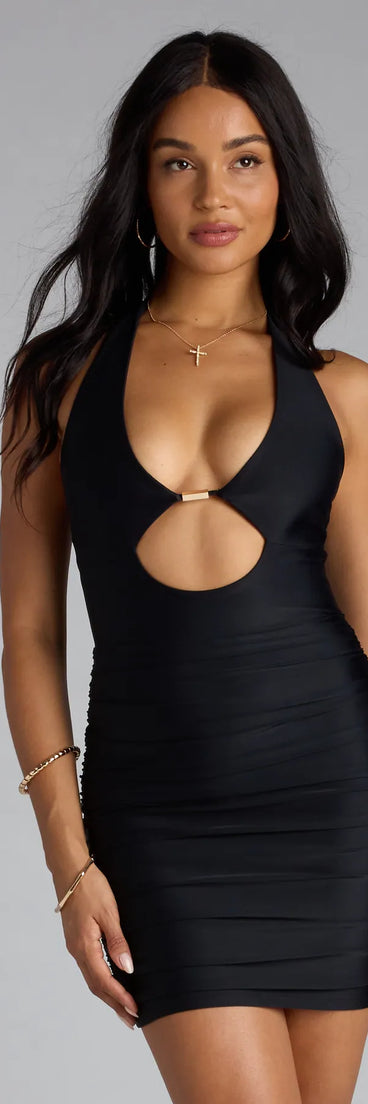 The Gorgeously Sultry Halter Cutout Mini Dress is your new go-to black dress—effortless, versatile, and made to update your fall style in seconds.