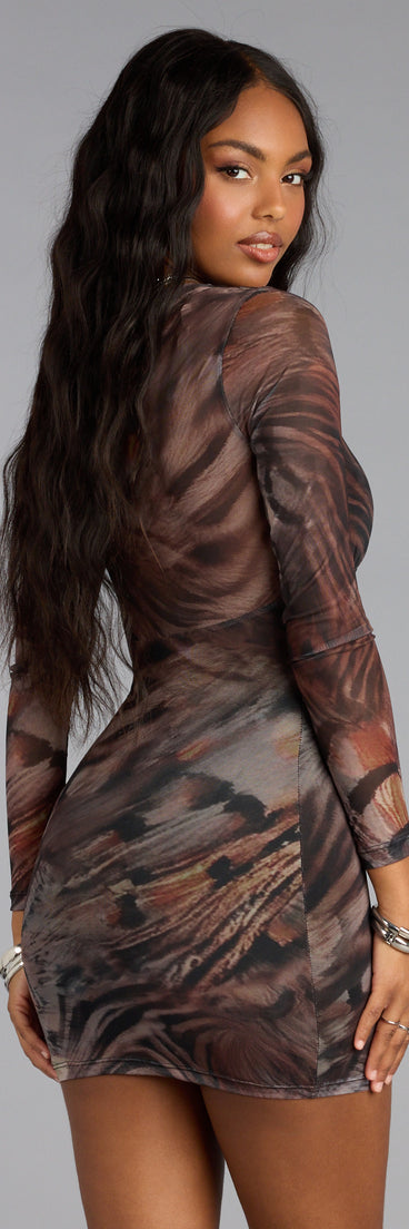 The Night Heat Cutout Mesh Mini Dress is your new go-to Windsor dress—effortless, versatile, and made to update your fall style in seconds.