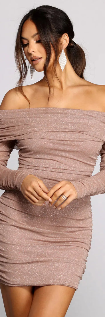 Bring a fun and feminine vibe with the Shimmer Nights Off the Shoulder Glitter Mini Dress, a scroll-stopping style from Windsor's pink homecoming dress collection that brings playful charm to every HOCO moment.