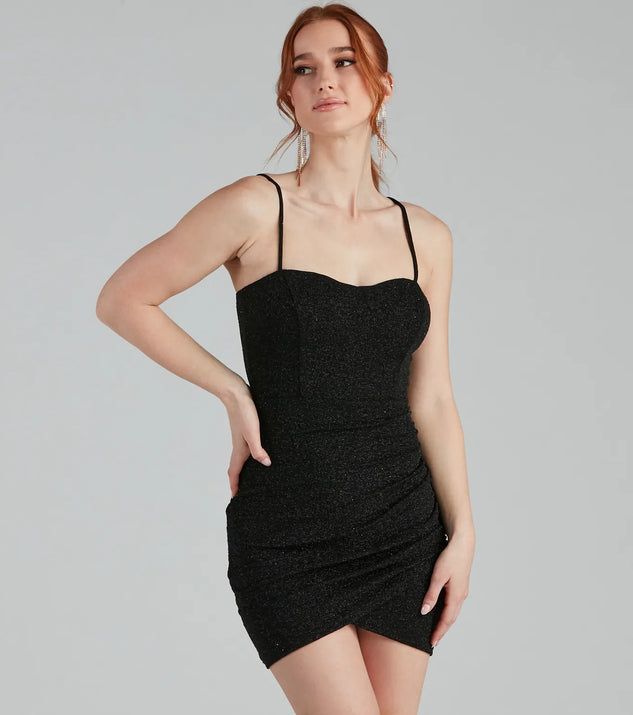 Step into winter chic with the Let It Glitz Glitter Sweetheart Mini Dress, a black mini dress featuring an above-the-knee cut ideal for cocktail parties, festive gatherings, or clubwear.