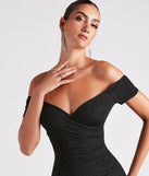 The Radiant Glitter Off-The-Shoulder Dress in black brings sleek style to any graduation outfit, from cap and gown to after-party.