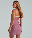 The Forever Perfect Glitter Rhinestone Party Dress is a stunning raisin purple mini dress with a short hem, designed to be the perfect winter cocktail dress or night-out look for Valentine's Day.