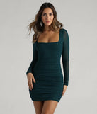 Make a bold statement in the Tonight's Vibe Glitter Long Sleeve Short Dress in hunter green, the perfect green dress for weddings, cocktail hours, nights out, and/or seasonal celebrations.