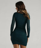 Flaunt your silhouette in the tight Tonight's Vibe Glitter Long Sleeve Short Dress in hunter green, a bodycon dress that empowers your look with bold style and effortless edge.