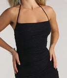 Make a bold statement in the Under My Spell Glitter Halter Mini Dress in black, the perfect summer dress for weddings, cocktail hours, nights out, and/or seasonal celebrations.