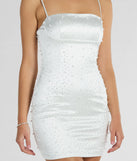 Step into winter chic with the Contemporary Charm Faux Pearl Rhinestone Satin Mini Dress, a multi-color mini dress featuring an above-the-knee cut ideal for cocktail parties, festive gatherings, or clubwear.