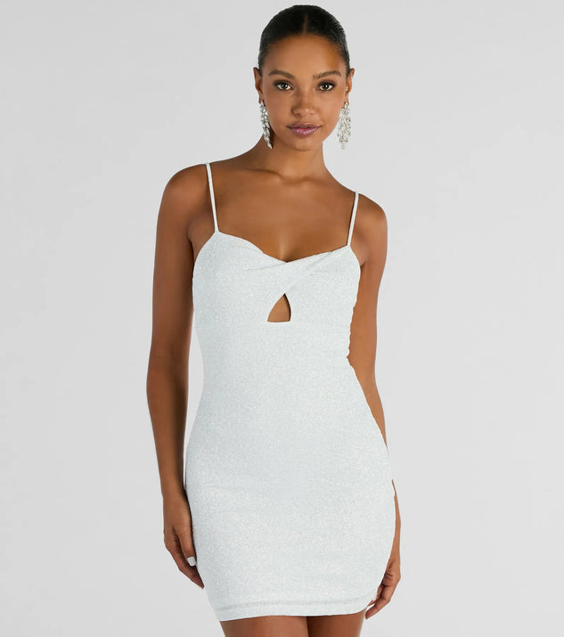 The Glitzy Shine Twist-Front Glitter Mini Dress is a mini dress that will make a statement with its short hemline and on-trend details to have you ready for any event!