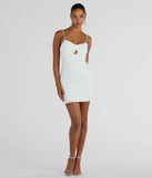 Revamp your 2025 wardrobe with this chic addition, the Glitzy Shine Twist-Front Glitter Mini Dress in white, perfect for elevating your style in the new year.