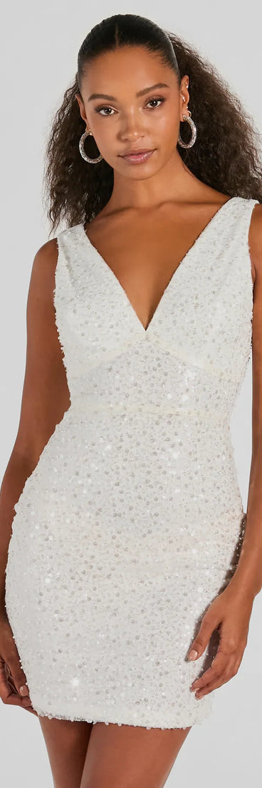 Turn heads in the beaming Ready To Sparkle V-Neck Bodycon Sequin Mini Dress, a stunning white sequin dress designed to add sparkle and elegance to your next night out or special occasion.