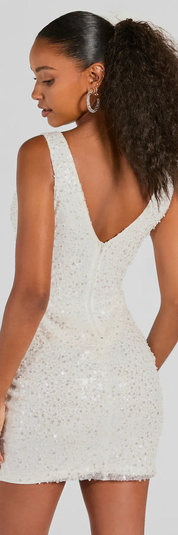 Make a statement in the Ready To Sparkle V-Neck Bodycon Sequin Mini Dress, a white bodycon dresses that blends unique design details with a tight silhouette for a head-turning holiday or New Year's eve dress.