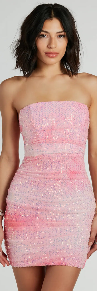 Turn heads in the beaming Enchanting Muse Iridescent Sequin Mini Dress, a stunning pink sequin dress designed to add sparkle and elegance to your next night out or special occasion.