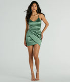 Make a bold statement in the Luxe Guaranteed Satin Bodycon Mini Dress in sage green, the perfect green dress for weddings, cocktail hours, nights out, and/or seasonal celebrations.