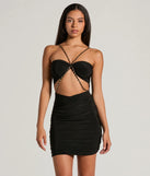 Step into winter chic with the Sexy Moves Chain Halter Strap Cutout Mini Dress, a black mini dress featuring an above-the-knee cut ideal for cocktail parties, festive gatherings, or clubwear.