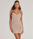 Step into seasonal chic with the Glitzy Allure Glitter Strappy Back Mini Dress, a raisin purple mini dress featuring an above-the-knee cut ideal for cocktail parties, festive gatherings, or clubwear.