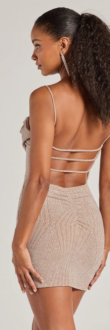 Revamp your 2025 wardrobe with this chic addition, the Glitzy Allure Glitter Strappy Back Mini Dress in taupe, perfect for elevating your style in the new year.