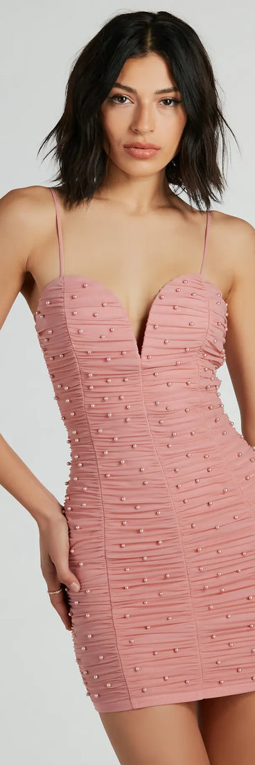 Turn heads at Prom 2025 in this pink prom dress, where statement-making details meet the iconic style of the Pearly Babe Ruched Mesh Party Dress .