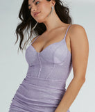 The Sparkle Avenue Lace-Up Glitter Mini Dress is a stunning lavender mini dress with a short hem, designed to be the perfect winter cocktail dress or night-out look for the holiday season.