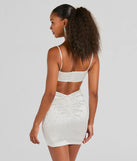 Revamp your 2025 wardrobe with this chic addition, the Shine Bright Babe V-Neck Rhinestone Satin Mini Dress in white, perfect for elevating your style in the new year.