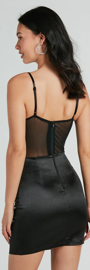 The Sexy Chic Ruched Satin And Mesh Corset Mini Dress is a mini dress in black, perfect for an above-the-knee holiday party dress or a stylish NYE look, with a short hemline designed to make a winter statement.