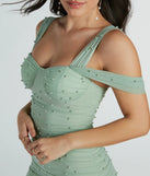 The Extra Special Sweetheart Faux Pearl Mini Dress is a sage green dress, an essential holiday or NYE dress that pairs chic style with versatility making it perfect for cocktail events, New Year's Eve parties, or as a winter wedding guest look.