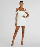 The Breathtaking Impression Faux Pearl Bodycon Mini Dress is a stunning white mini dress with a short hem, designed to be the perfect cocktail dress or night-out look for transitional weather.