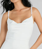 The Reason To Celebrate Faux Pearl Strap Mini Dress is a stunning white mini dress with a short hem, designed to be the perfect winter cocktail dress or night-out look for the holiday season.