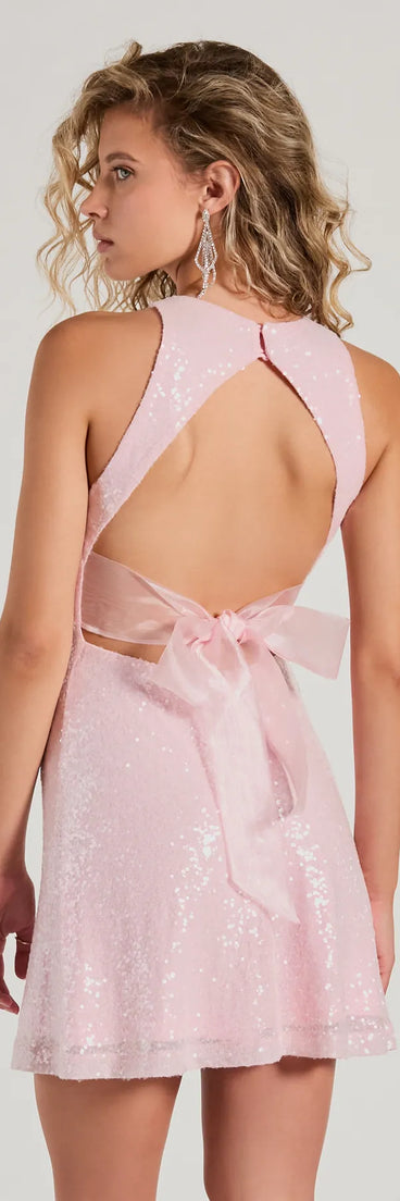 The Make A Statement Tulle Bow A-Line Sequin Mini Dress is a mini dress that will make a statement with its short hemline and on-trend details to have you ready for any event!