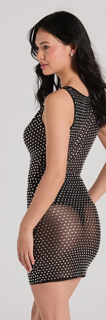 The Remarkable Show-Stopper Rhinestone Mesh Mini Dress is a mini dress in black, perfect for an above-the-knee holiday party dress or a stylish NYE look, with a short hemline designed to make a winter statement.